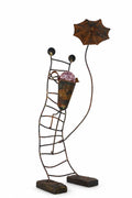 Sculpture lumineuse en métal patiné – “Le Porteur d’Ombrelle”